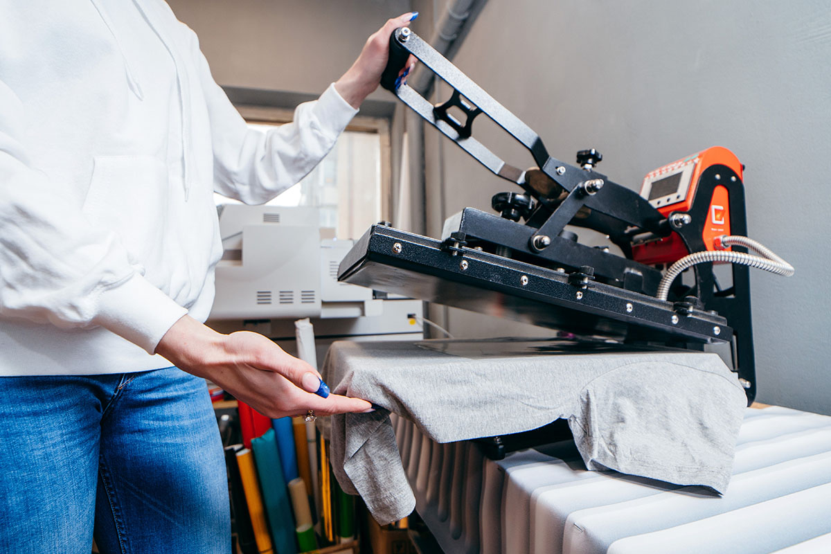 Desktop thermo press for printing images on fabric.